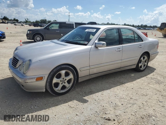 2002 Mercedes-Benz E-Class with VIN WDBJF65J02B495961, listed as a Copart auction lot 73844554 with 99,380 mi miles and Salvage Title. Bid and sale history available at carsss.com. Image 1.