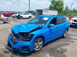 2021 BMW X1 xDrive28i with VIN WBXJG9C04M5T61811, listed as a IAAI auction lot 42509852 with 30,400 mi miles and . Bid and sale history available at DreamBid. Image 17.
