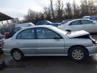 2001 Kia Rio with VIN KNADC123716042067, listed as a IAAI auction lot 41449479 with 113,108 mi miles. Bid and sale history available at carsss.com. Image 13.