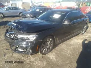 2018 BMW 7 Series 740i with VIN WBA7E2C57JG742257, listed as a IAAI auction lot 41353435 with 77,125 mi miles. Bid and sale history available at carsss.com. Image 18.