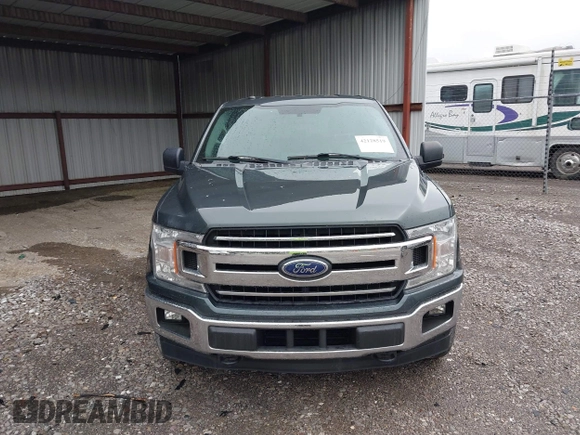 2018 Ford F-150 XL with VIN 1FTEW1EG4JKE17790, listed as a IAAI auction lot 42128519 with 153,740 mi miles. Bid and sale history available at carsss.com. Image 12.