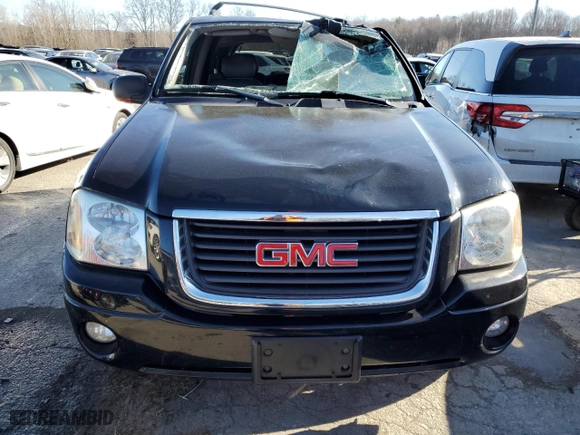 2004 GMC Envoy SLE with VIN 1GKDT13S842377007, listed as a Copart auction lot 88579415 with 107,069 mi miles and Salvage Title. Bid and sale history available at carsss.com. Image 5.