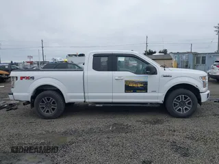 2015 Ford F-150 XLT with VIN 1FTEX1EP1FFA21653, listed as a IAAI auction lot 41597518 with 153,111 mi miles and . Bid and sale history available at DreamBid. Image 14.