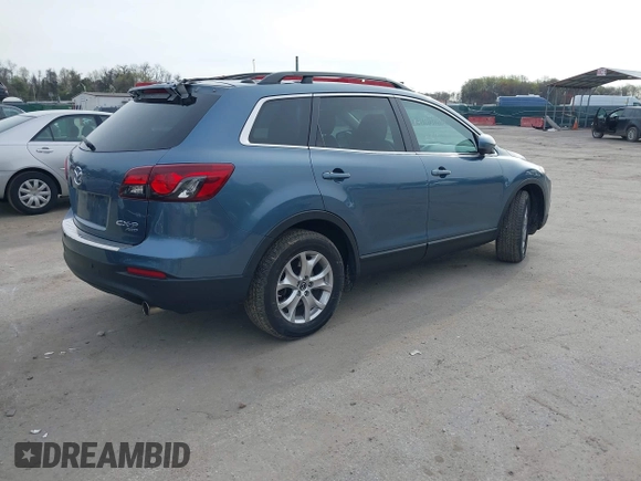 2015 Mazda CX-9 Touring with VIN JM3TB3CVXF0460959, listed as a IAAI auction lot 41940912 with 166,674 mi miles and . Bid and sale history available at DreamBid. Image 4.