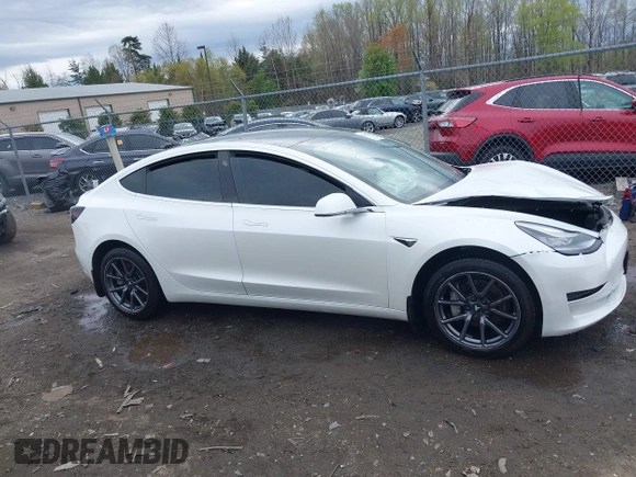 2019 Tesla Model 3 Mid Range with VIN 5YJ3E1EA5KF397098, listed as a IAAI auction lot 41943570 with 72,046 mi miles and . Bid and sale history available at DreamBid. Image 13.