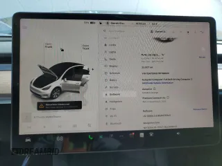 2023 Tesla Model Y Long Range z VIN 7SAYGDEE7PF788932, wystawiony jako Copart lot #52822515 z przebiegiem 33 007 mil mil oraz Szkoda całkowita • Salvage title. Historia ofert i sprzedaży dostępna na DreamBid. Obrazek 9.