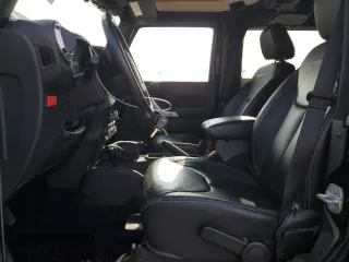 2015 Jeep Wrangler Rubicon Hard Rock z VIN 1C4BJWCG9FL714606, wystawiony jako Copart lot #68521014 z przebiegiem 35 187 mil mil oraz Szkoda całkowita • Salvage title. Historia ofert i sprzedaży dostępna na DreamBid. Obrazek 7.