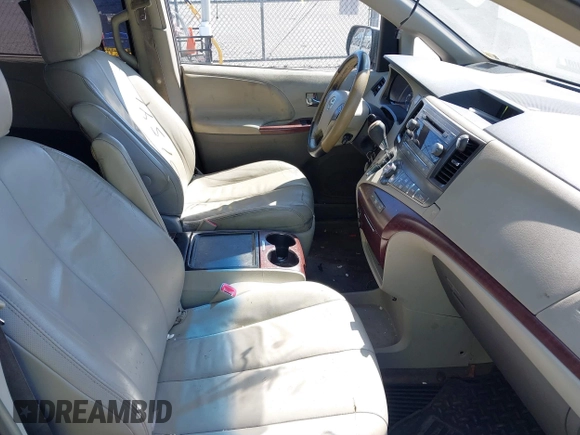 2012 Toyota Sienna XLE with VIN 5TDDK3DC1CS047105, listed as a IAAI auction lot 41901541 with 176,476 mi miles. Bid and sale history available at carsss.com. Image 5.