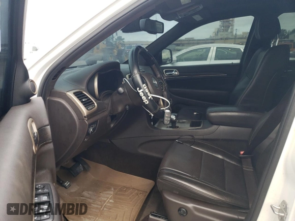 2015 Jeep Grand Cherokee Summit with VIN 1C4RJEJG8FC131925, listed as a Copart auction lot 55270785 with 130,425 mi miles and Salvage title. Bid and sale history available at DreamBid. Image 7.