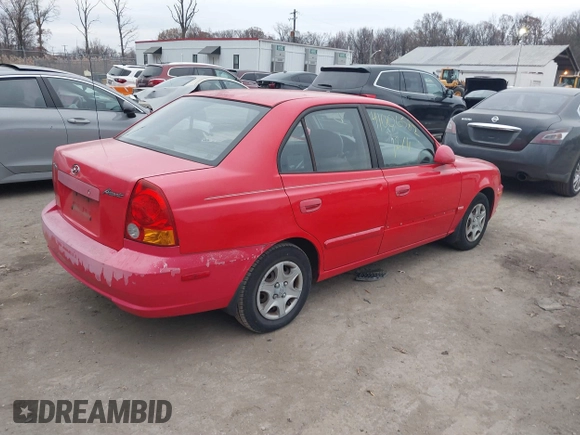 2005 Hyundai Accent GLS with VIN KMHCG45CX5U614083, listed as a IAAI auction lot 41006582 with 72,516 mi miles. Bid and sale history available at carsss.com. Image 4.