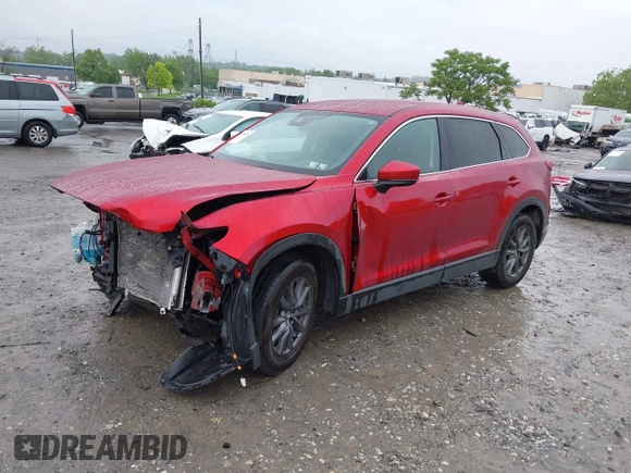 2022 Mazda CX-9 Touring with VIN JM3TCBCY9N0613508, listed as a IAAI auction lot 42258870 with 46,911 mi miles and . Bid and sale history available at DreamBid. Image 2.