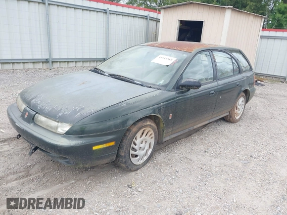1999 Saturn SW z VIN 1G8ZK8271XZ314797, wystawiony jako IAAI lot #41843385 z przebiegiem 91 599 mil mil oraz . Historia ofert i sprzedaży dostępna na DreamBid. Obrazek 2.