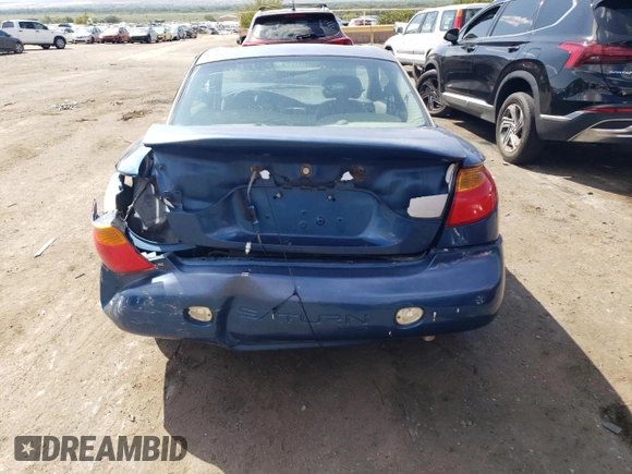 2001 Saturn SC z VIN 1G8ZR12731Z256766, wystawiony jako Copart lot #70595904 z przebiegiem Nie podano mil oraz Szkoda całkowita • Salvage title. Historia ofert i sprzedaży dostępna na DreamBid. Obrazek 6.