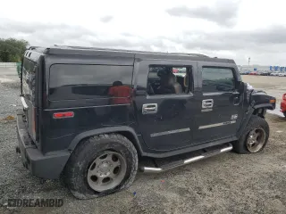 2003 Hummer H2 with VIN 5GRGN23UX3H121939, listed as a Copart auction lot 69503424 with 170,144 mi miles and Salvage Title. Bid and sale history available at carsss.com. Image 3.