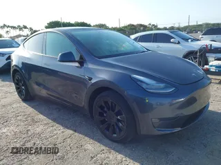 2023 Tesla Model Y Long Range z VIN 7SAYGDEE5PA099226, wystawiony jako IAAI lot #42004061 z przebiegiem 10 607 mil mil oraz . Historia ofert i sprzedaży dostępna na DreamBid. Obrazek 1.