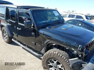 2023 Jeep Wrangler Willys with VIN 1C4HJXDN0PW597768, listed as a IAAI auction lot 41645815 with 23,717 mi miles and . Bid and sale history available at DreamBid. Image 6.