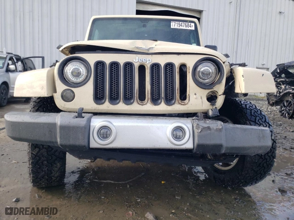 2011 Jeep Wrangler Unlimited Sahara with VIN 1J4BA5H19BL593658, listed as a Copart auction lot 71947684 with 122,323 mi miles and Salvage Title. Bid and sale history available at carsss.com. Image 5.
