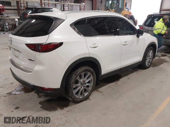 2020 Mazda CX-5 Grand Touring with VIN JM3KFBDM6L1828611, listed as a IAAI auction lot 42006976 with 59,939 mi miles and . Bid and sale history available at DreamBid. Image 4.