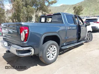 2019 GMC Sierra 1500 SLT z VIN 3GTP8DED1KG229179, wystawiony jako IAAI lot #41932481 z przebiegiem Nie podano mil oraz . Historia ofert i sprzedaży dostępna na DreamBid. Obrazek 4.