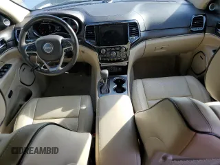 2019 Jeep Grand Cherokee Overland with VIN 1C4RJFCT2KC834690, listed as a Copart auction lot 84303144 with 63,053 mi miles and Salvage Title. Bid and sale history available at carsss.com. Image 8.