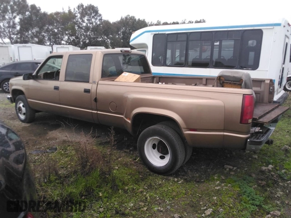 1996 GMC Sierra 1500 with VIN 1GTHC33J4TF010466, listed as a Copart auction lot 48392195 with 143,267 mi miles and Salvage Title. Bid and sale history available at DreamBid. Image 2.