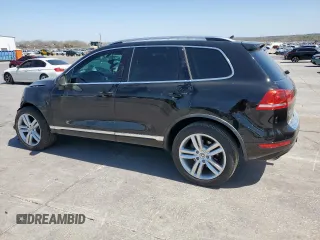 2013 Volkswagen Touareg Exec z VIN WVGEF9BPXDD007602, wystawiony jako Copart lot #50031785 z przebiegiem 93 859 mil mil oraz Szkody całkowita. Historia ofert i sprzedaży dostępna na DreamBid. Obrazek 2.