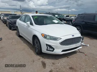 2020 Ford Fusion Titanium with VIN 3FA6P0D98LR151810, listed as a IAAI auction lot 42590902 with 76,624 mi miles and . Bid and sale history available at DreamBid. Image 1.