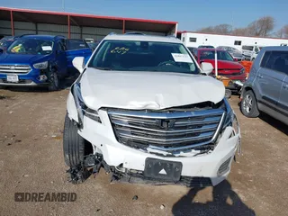 2017 Cadillac XT5 Premium Luxury AWD z VIN 1GYKNERS3HZ284561, wystawiony jako IAAI lot #41887147 z przebiegiem 119 189 mil mil oraz . Historia ofert i sprzedaży dostępna na DreamBid. Obrazek 12.