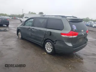 2013 Toyota Sienna XLE AAS with VIN 5TDYK3DC8DS401561, listed as a IAAI auction lot 41990044 with 214,111 mi miles and . Bid and sale history available at DreamBid. Image 3.