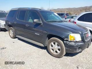 2004 GMC Envoy SLE with VIN 1GKDS13S242370041, listed as a IAAI auction lot 41698413 with 158,160 mi miles. Bid and sale history available at carsss.com. Image 1.
