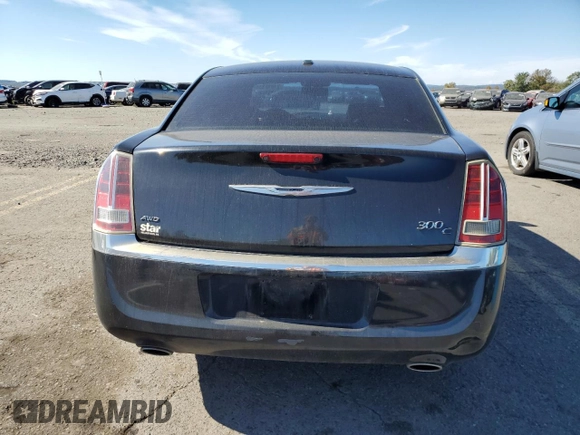 2013 Chrysler 300 C with VIN 2C3CCAKG0DH683117, listed as a Copart auction lot 74812334 with 187,308 mi miles and Salvage Title. Bid and sale history available at DreamBid. Image 6.