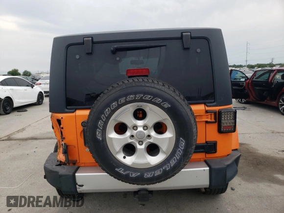2013 Jeep Wrangler Sahara с VIN 1C4AJWBG4DL557688, выставлен на аукционе Copart как лот 57789095 с пробегом 104 461 миль миль и Списание • Salvage title. История ставок и продаж доступна на DreamBid. Изображение 6.