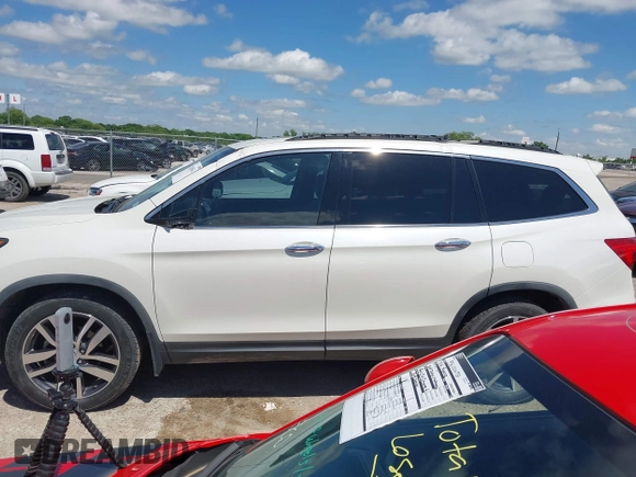 2017 Honda Pilot Touring with VIN 5FNYF6H92HB054145, listed as a IAAI auction lot 42200391 with 70,096 mi miles and . Bid and sale history available at DreamBid. Image 14.