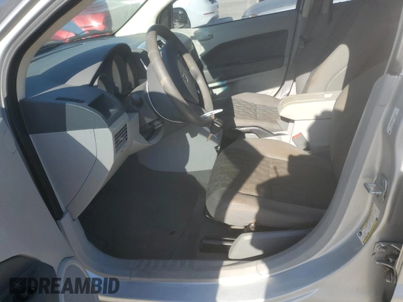 2007 Dodge Caliber with VIN 1B3HB28B07D111196, listed as a Copart auction lot 52488495 with 123,409 mi miles and Salvage Title. Bid and sale history available at DreamBid. Image 7.