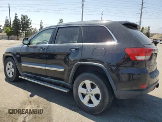 2011 Jeep Grand Cherokee Laredo with VIN 1J4RR4GG0BC563603, listed as a Copart auction lot 60237475 with 243,885 mi miles and Salvage title. Bid and sale history available at DreamBid. Image 2.