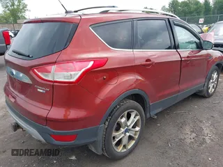 2015 Ford Escape Titanium z VIN 1FMCU9J98FUC84963, wystawiony jako IAAI lot #42469112 z przebiegiem 128 838 mil mil oraz . Historia ofert i sprzedaży dostępna na DreamBid. Obrazek 4.
