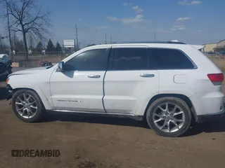 2015 Jeep Grand Cherokee Summit with VIN 1C4RJFJGXFC734025, listed as a IAAI auction lot 41842927 with 137,993 mi miles. Bid and sale history available at carsss.com. Image 14.