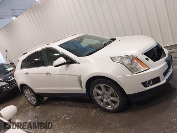 2012 Cadillac SRX Premium Collection z VIN 3GYFNFE38CS591123, wystawiony jako IAAI lot #41827636 z przebiegiem 143 867 mil mil oraz . Historia ofert i sprzedaży dostępna na DreamBid. Obrazek 14.
