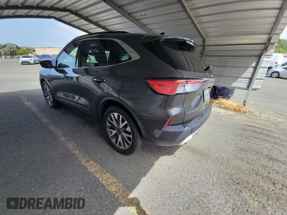 2020 Ford Escape Titanium Hybrid with VIN 1FMCU0DZ2LUB82013, listed as a IAAI auction lot 42727391 with 92,623 mi miles and . Bid and sale history available at DreamBid. Image 5.