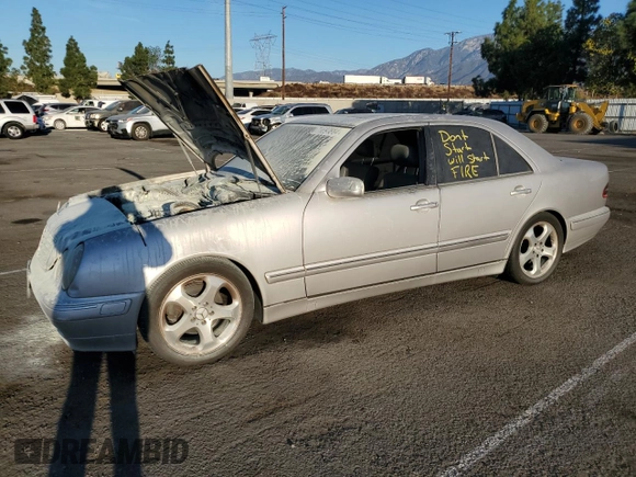 2002 Mercedes-Benz E-Class with VIN WDBJF65J32B496411, listed as a Copart auction lot 75690884 with 128,855 mi miles and Salvage Title. Bid and sale history available at carsss.com. Image 1.