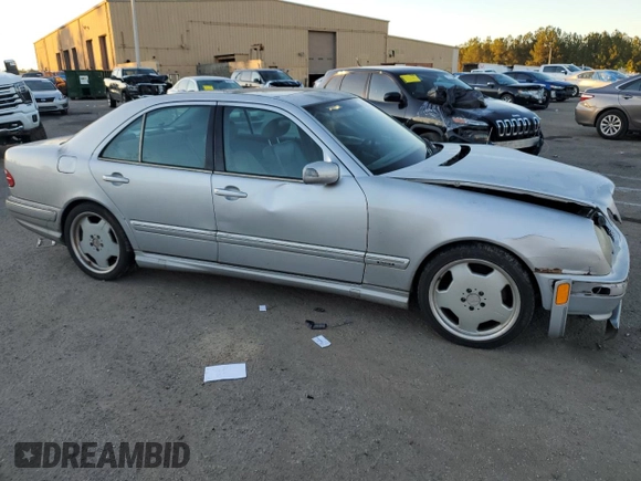 2000 Mercedes-Benz E-Class with VIN WDBJF70JXYB113988, listed as a Copart auction lot 86325514 with 198,321 mi miles and Salvage Title. Bid and sale history available at carsss.com. Image 4.