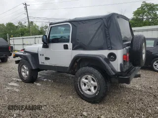 2004 Jeep Wrangler X with VIN 1J4FA39S24P714961, listed as a Copart auction lot 57871235 with 123,164 mi miles and Clean title. Bid and sale history available at DreamBid. Image 2.