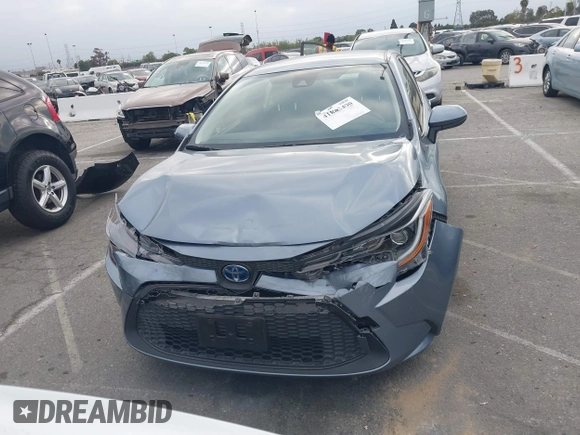 2022 Toyota Corolla Hybrid LE with VIN JTDEAMDE4NJ041913, listed as a IAAI auction lot 41883490 with 23,063 mi miles. Bid and sale history available at carsss.com. Image 12.