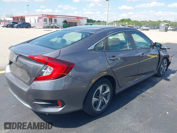 2020 Honda Civic LX with VIN 19XFC2F68LE007735, listed as a IAAI auction lot 42215294 with 3,849 mi miles and . Bid and sale history available at DreamBid. Image 4.