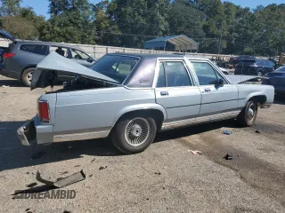 1989 Ford Crown Victoria z VIN 2FABP74F2KX141884, wystawiony jako Copart lot #74934494 z przebiegiem 84 761 mil mil oraz Szkoda całkowita • Salvage title. Historia ofert i sprzedaży dostępna na DreamBid. Obrazek 3.