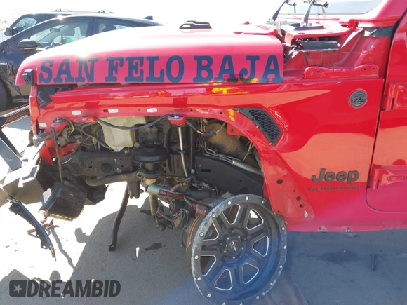 2022 Jeep Gladiator Willys Sport z VIN 1C6HJTAG0NL180848, wystawiony jako IAAI lot #41778129 z przebiegiem Nie podano mil oraz . Historia ofert i sprzedaży dostępna na DreamBid. Obrazek 18.