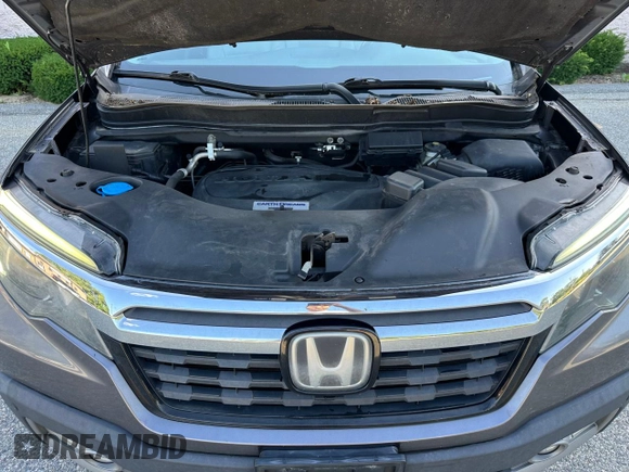 2019 Honda Ridgeline RTL-E with VIN 5FPYK3F71KB009532, listed as a Copart auction lot 65827935 with 217,177 mi miles and Clean title. Bid and sale history available at DreamBid. Image 7.