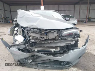 2025 Honda Civic Sport z VIN 2HGFE2F56SH505972, wystawiony jako IAAI lot #41634259 z przebiegiem 11 043 mil mil oraz . Historia ofert i sprzedaży dostępna na DreamBid. Obrazek 13.