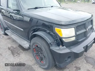 2007 Dodge Nitro SXT with VIN 1D8GT28K17W605984, listed as a IAAI auction lot 41970841 with 118,700 mi miles. Bid and sale history available at carsss.com. Image 6.