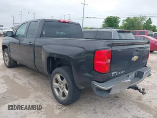 2014 Chevrolet Silverado 1500 LT with VIN 1GCRCREH5EZ371465, listed as a IAAI auction lot 42185657 with 112,151 mi miles and . Bid and sale history available at DreamBid. Image 3.